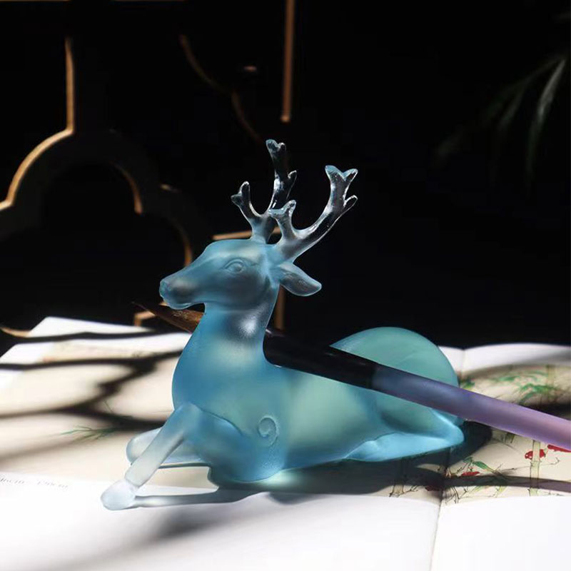Blue glass deer-shaped brush holder
