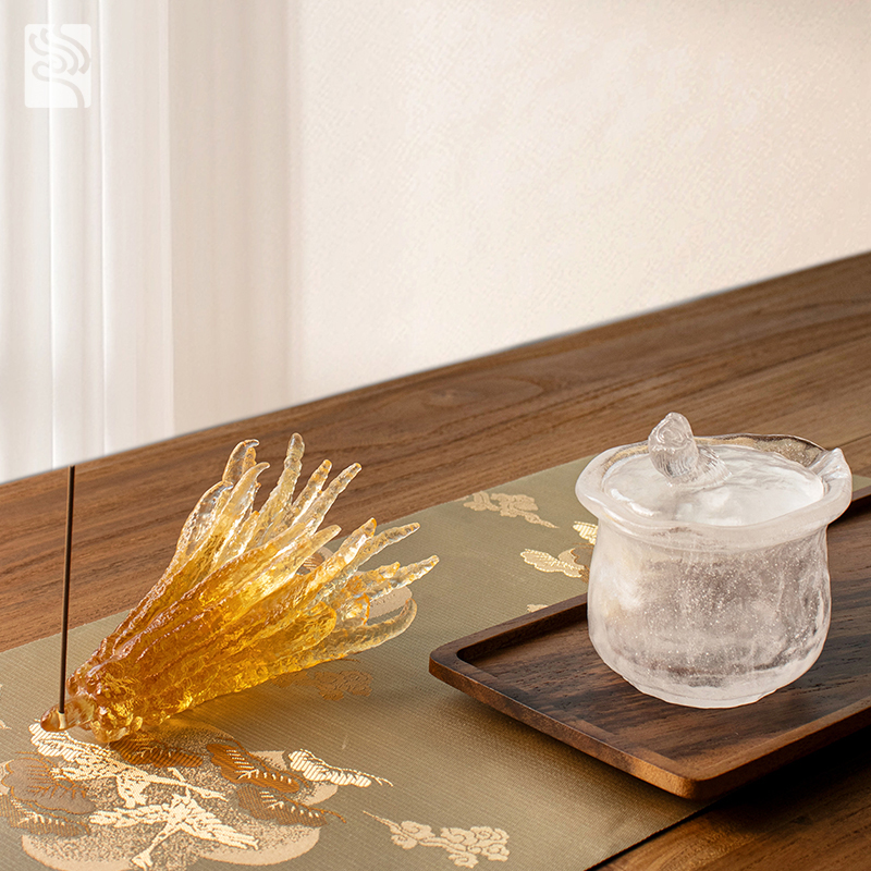 Hand-shaped golden colored glass incense holder