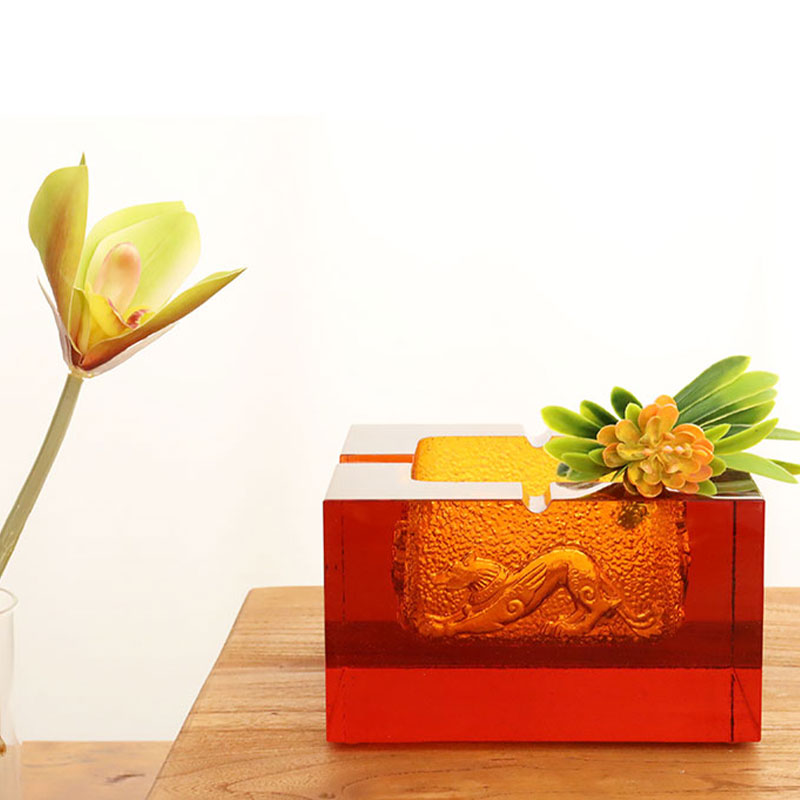 Red glass ashtray with exquisite embossed animal patterns